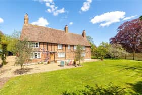 This family home has an instant wow factor with its timber framed, brick facade.