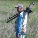 Peter Smith MBE, pictured birdwatching at The Sandy Smith Nature Reserve. Photo: Peter Smith.