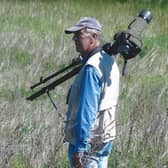 Peter Smith MBE, pictured birdwatching at The Sandy Smith Nature Reserve. Photo: Peter Smith.