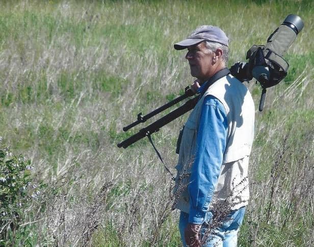 Peter Smith MBE, pictured birdwatching at The Sandy Smith Nature Reserve. Photo: Peter Smith.