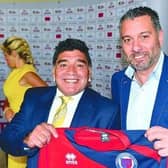 Diego Maradona was happy to pose with the Biggleswade United shirt