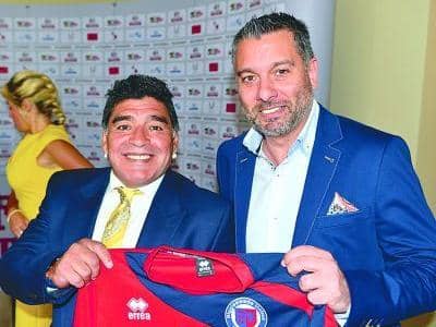Diego Maradona was happy to pose with the Biggleswade United shirt