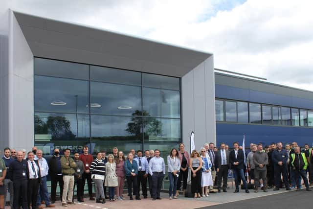 Staff outside the new premises