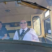 Cllr Mackin receives a ride in the Green Goddess fire engine (from his days in the Auxiliary Fire Service) that was arranged to take him home from the annual town meeting during his last week as Mayor. Photo: Cllr Paul Mackin.