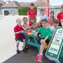 Children at the school enjoying the new bench