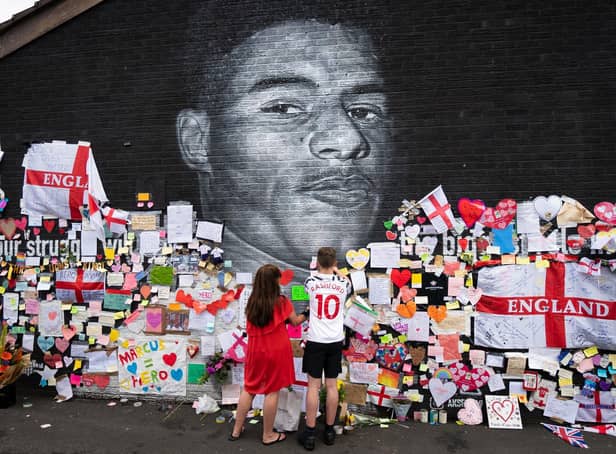 Messages of support and solidarity were left on the mural of footballer Marcus Rashford in Manchester, after it was defaced following England's Euro 2020 final defeat