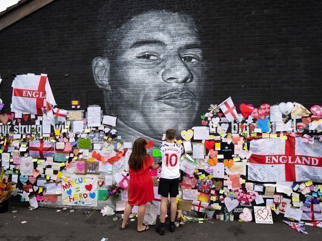 Messages of support and solidarity were left on the mural of footballer Marcus Rashford in Manchester, after it was defaced following England's Euro 2020 final defeat