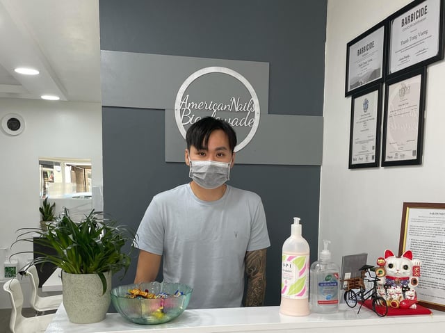 Staff will still wear face masks in American Nails. Photo: American Nails.