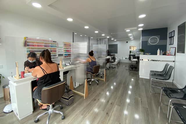 Protective screens will still remain in place at American Nails. Photo: American Nails.