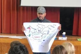 Spoken word artist Quinton Green holding a workshop
