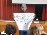 Spoken word artist Quinton Green holding a workshop