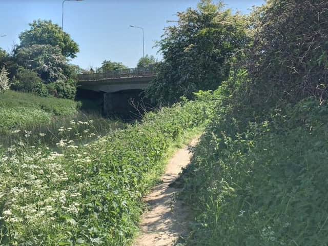 The underpass by the riverside walk is frequently filled with mud and water