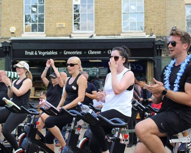 Visitors enjoy a spin class in the Market Square! Photo: BBC.