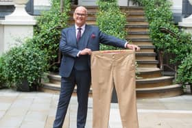Ken McLeod with a pair of his old trousers