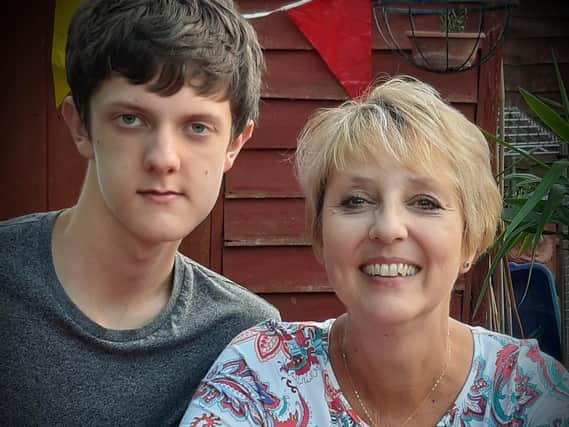 Leo Toze with his mum. (PIC: British Transport Police)