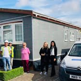 Operatives with resident in the process of installing the external insulation