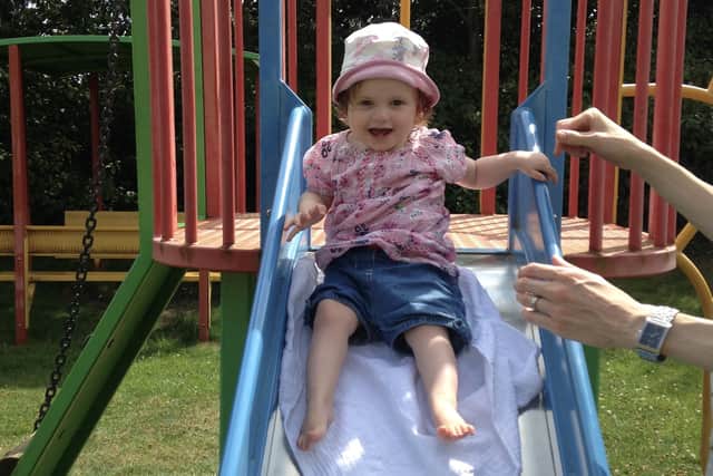 A child enjoys a go on the slide in the sunshine. Image supplied by Chronicle reader.