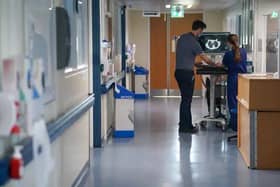 Doctor in a hospital ward. Picture: Jeff Moore PA Images / Alamy Stock Photo