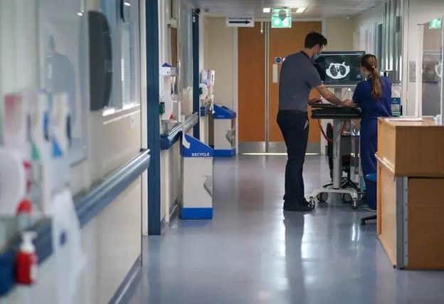 Doctor in a hospital ward. Picture: Jeff Moore PA Images / Alamy Stock Photo
