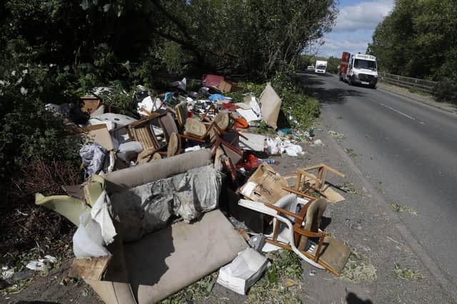 File image of fly-tipped rubbish. It's feared the new rules could lead to an increase in fly-tipping (Photo by ADRIAN DENNIS/AFP via Getty Images)