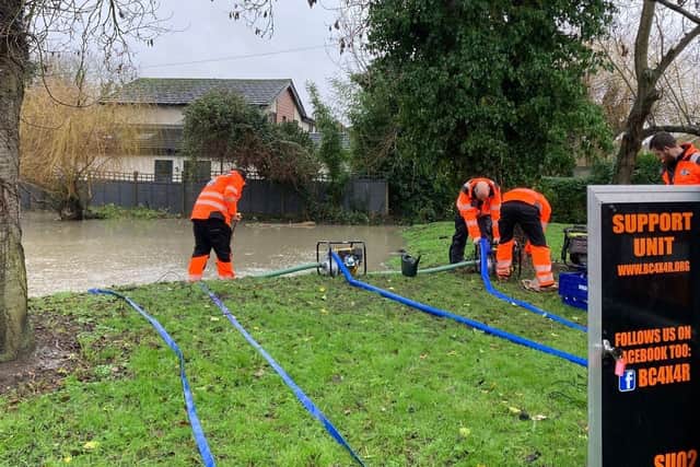 Clearing out flood water in Blunham - Photo credit: Bedfordshire Local Resilience Forum
