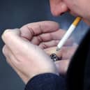 File photo of a man smoking a cigarette. Picture posed by model. Jonathan Brady/PA Wire