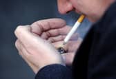 File photo of a man smoking a cigarette. Picture posed by model. Jonathan Brady/PA Wire