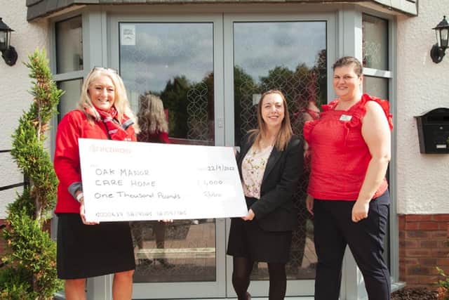 The cheque presentation at Oak Manor. Image: Redrow South Midlands.