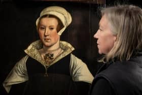 Rachel Turnbull, English Heritage’s senior collections conservator, views the mysterious portrait (Picture: English Heritage)