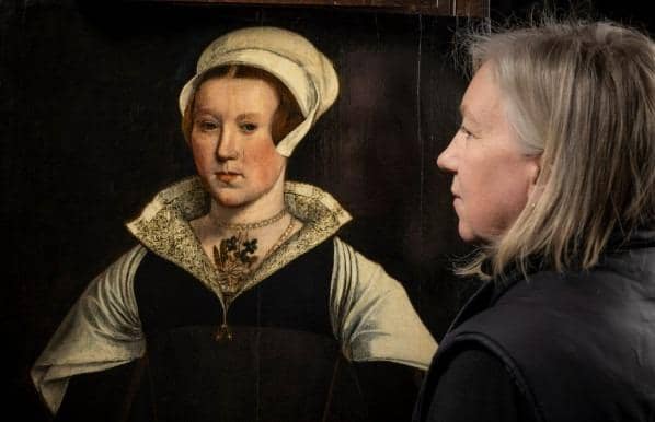 Rachel Turnbull, English Heritage’s senior collections conservator, views the mysterious portrait (Picture: English Heritage)