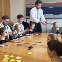 Ponytails in Parliament: Hitchin MP learns how style daughters’ hair to champion support for dads