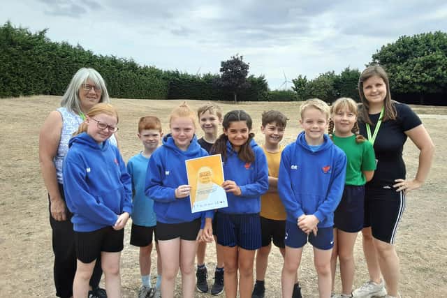 Staff and pupils from Langford Village Academy with their certificate. Image: BEST.