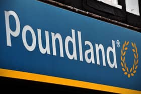 A sign is pictured on the exterior of a Poundland store (Photo by CARL COURT/AFP via Getty Images)