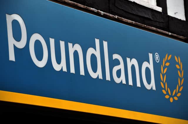 A sign is pictured on the exterior of a Poundland store (Photo by CARL COURT/AFP via Getty Images)