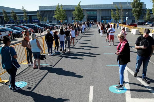 Thousands of shoppers were seen queuing for reopened shops in England