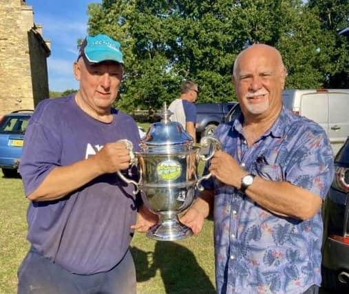 Winner Tony Sinfield (left) receives the Bedford Hospital Cup from former Biggleswade Chronicle sports editor Alan Wooding.