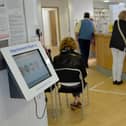 File photo of patients in the waiting room at a GP Practice