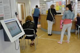 File photo of patients in the waiting room at a GP Practice