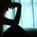 File image of the silhouette of a woman.