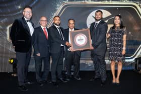 Henlow Tandoori owner Kowser Murshed Robin and his colleague receiving the Curry Life Award, hosted by BBC's Jon Kay and Luxmy Gopal.