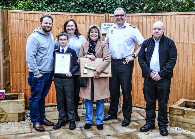Chief Fire Officer Andy Hopkinson, Firefighter Paul Barrows and family of Chris Page