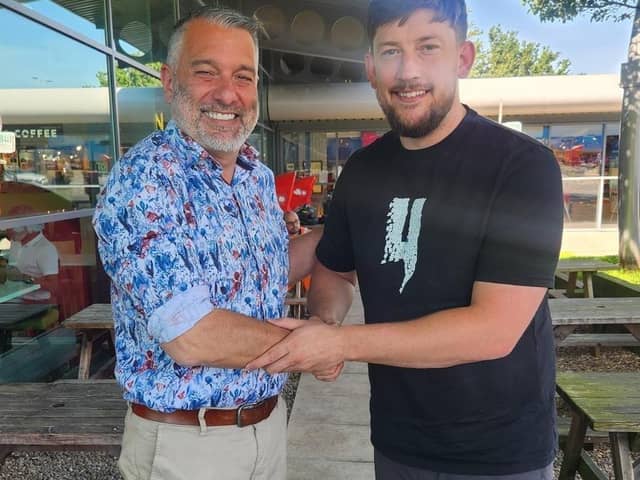 Kane Dougherty (right) with United chairman Guillem Balague.