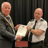 Paul Barrows pictured receiving the Honorary Freeman of the Town Award from Sandy mayor Cllr Martin Pettit