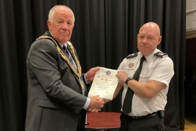 Paul Barrows pictured receiving the Honorary Freeman of the Town Award from Sandy mayor Cllr Martin Pettit