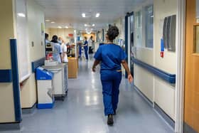 File photo of a general view of staff on a NHS hospital ward