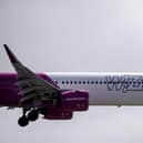 A Wizz Air jet comes in to land (Photo by BEN STANSALL/AFP via Getty Images)