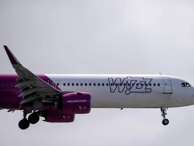 A Wizz Air jet comes in to land (Photo by BEN STANSALL/AFP via Getty Images)