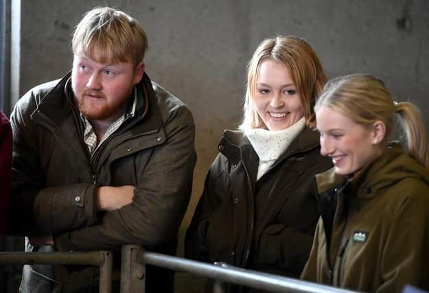Caitlin Oxton (with ponytail) from Clifton and Caitlyn Bartlett at Cirencester Livestock Market. Both girls are at Gloucester's Royal Agricultural University and were winners of the inaugural Kaleb Cooper agricultural bursary. Pic: Paul Nicholls