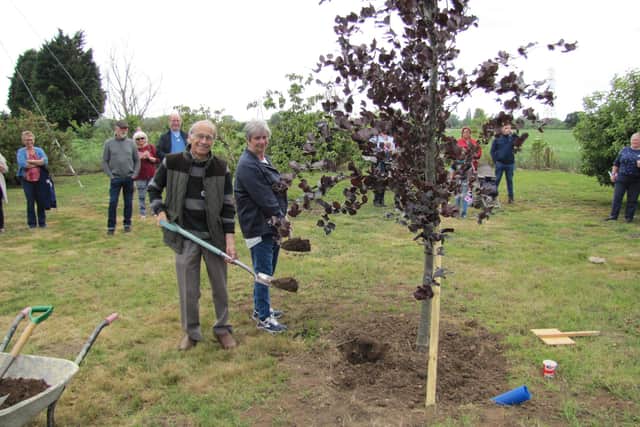 Stephen Gosling and Margaret Page (nee Beadle) planting a tree to Commemorate the Platinum Jubilee of Queen Elizabeth II, June 2022. Photo: Steve Cooney.