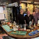 Cllr Steven Watkins, Cllr Adam Zerny, and the barman of the golden pheasant, Carl Spicer. Image supplied by Cllr Watkins.